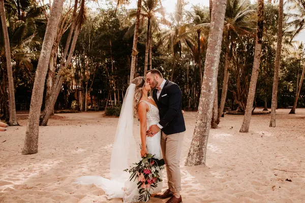 Editorial couple among beach palms